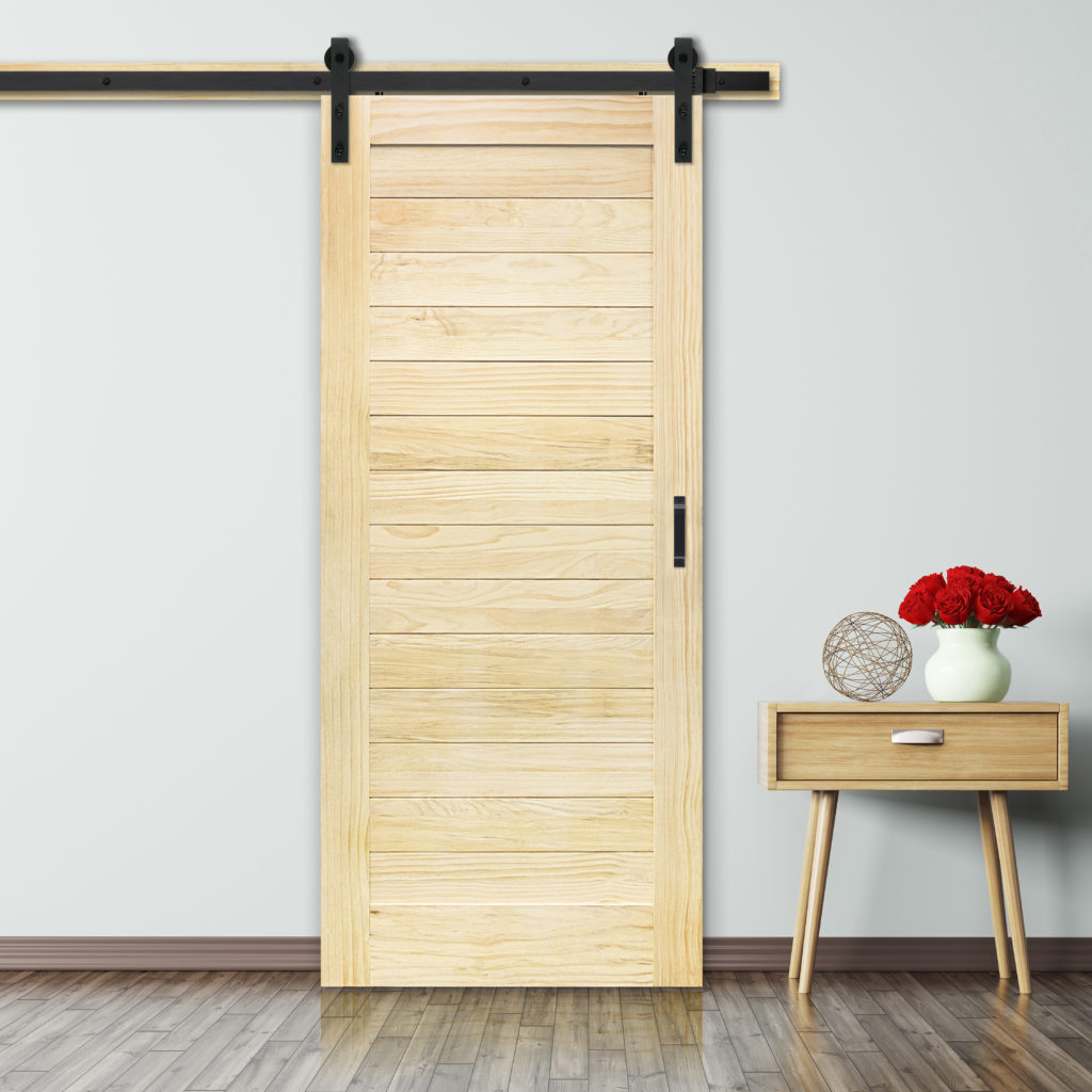 Unfinished barn door horizontal plank design in a room with matching side table