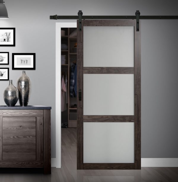 Close up of closed wooden door in the empty room with copy space