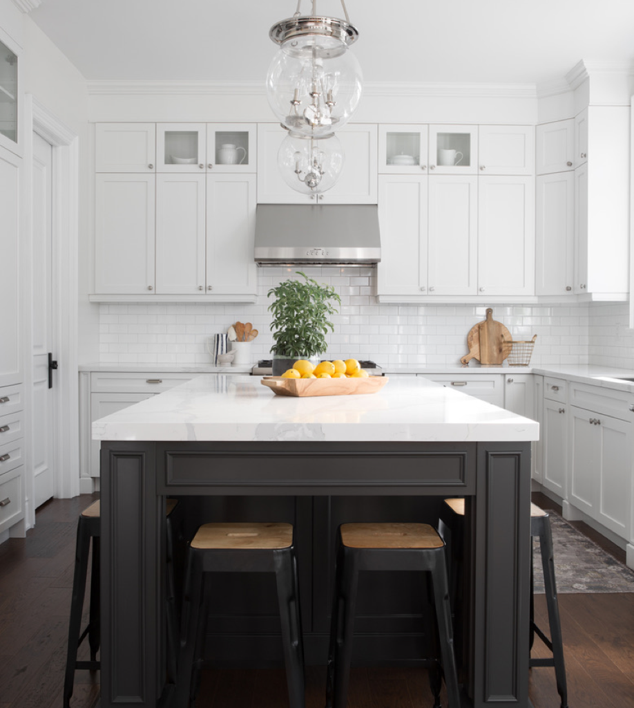 Design by Jodie Owen Design, Photo by Lauren Miller All white modern kitchen with a black centre island with black stools.